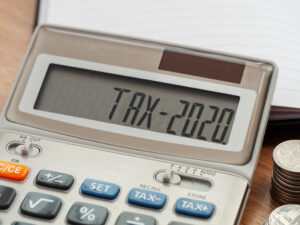 Tax Word And 2020 Number On Calculator. Business And Tax Concept