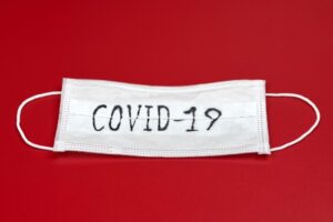 Face mask with Covid-19 note.
