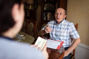 An man discussing elder law with an attorney in Long Island.
